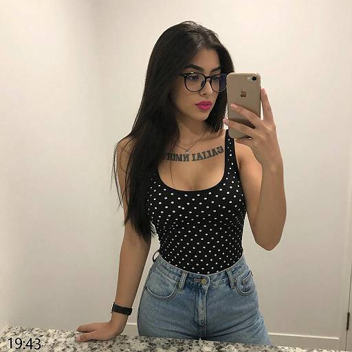 Young Woman Taking Mirror Selfie