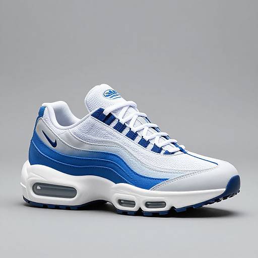 Photograph of a white and blue athletic sneaker with blue stripes, white mesh upper, and a white midsole with blue accents.