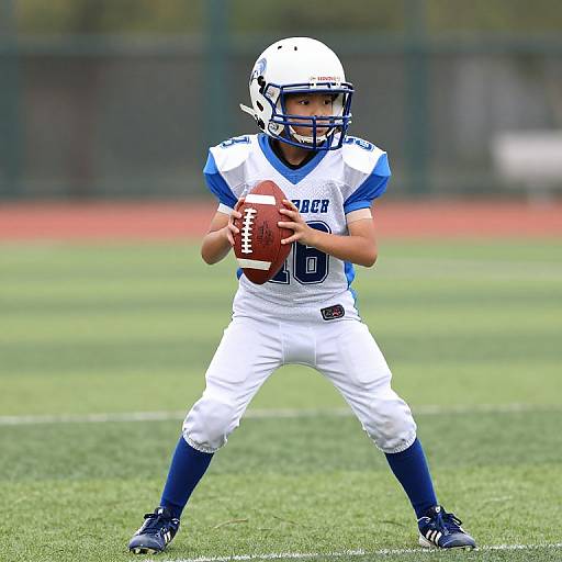 Boy in Football Uniform on Field