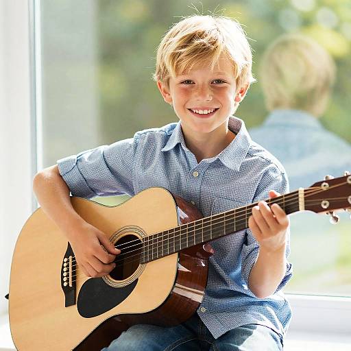 Joyful Young Boy Playing Guitar
