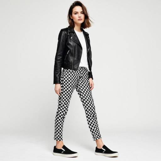 Woman in Black Leather Jacket and Checkered Pants
