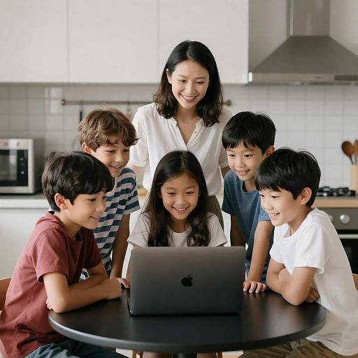Group of Children and Woman Using Laptop in Kitchen