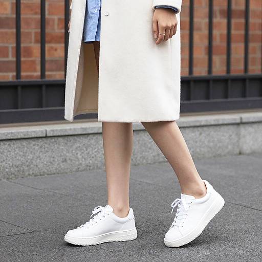 Woman Wearing White Coat and Sneakers