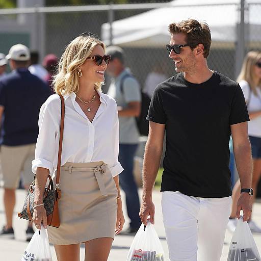 Smiling Couple Walking with Shopping Bags Outdoors