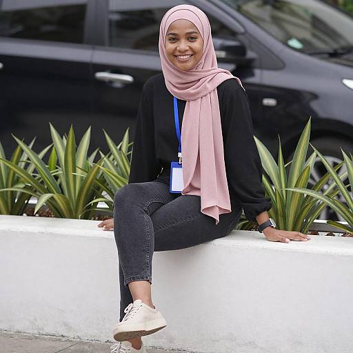 Smiling Woman in Pink Hijab Sitting