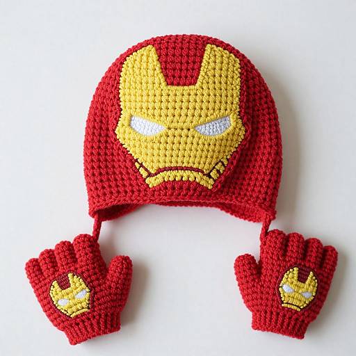 Crocheted red and yellow Iron Man hat with matching gloves, featuring a detailed face design with stern expression, against a white background.