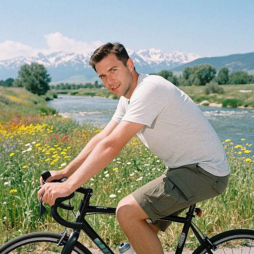 Man Cycling by Vibrant Riverbanks