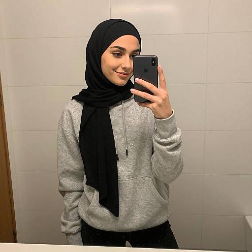 Young Woman in Hijab Taking Selfie