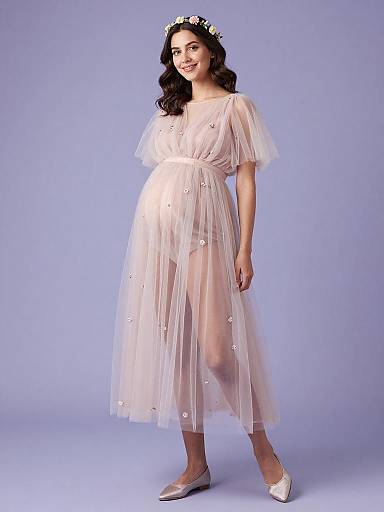 Pregnant Woman in Ethereal Maternity Dress