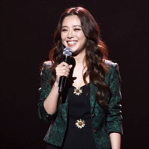 Smiling Woman Holding Microphone on Stage