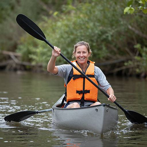 Joyful Woman Canoeing on Serene River