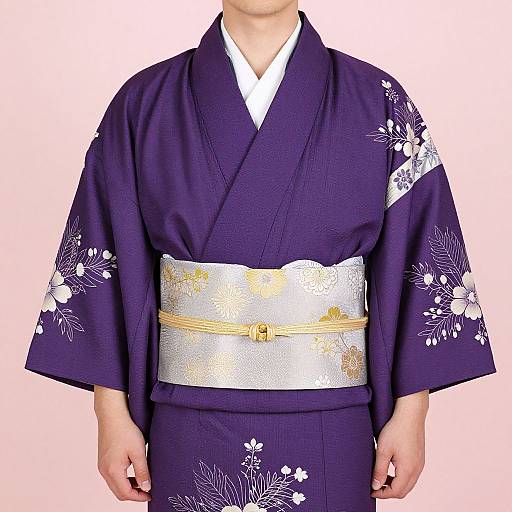 Photograph of a person wearing a deep purple kimono with white floral patterns, silver and gold obi belt, and white collar, set against a