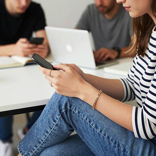 Striped Shirt Girl at Table with Laptop