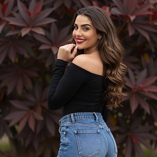 Smiling Woman in Off-Shoulder Top and Jeans