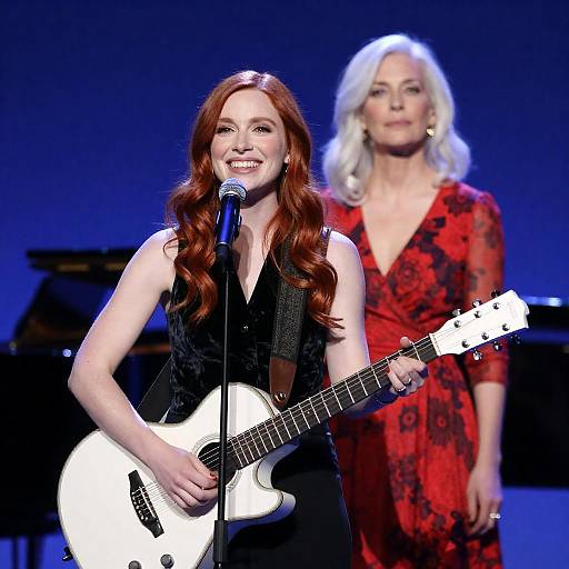 Dynamic Duo on Stage Under Blue Lights