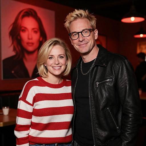 Smiling Couple in Dimly Lit Room with Red Lighting