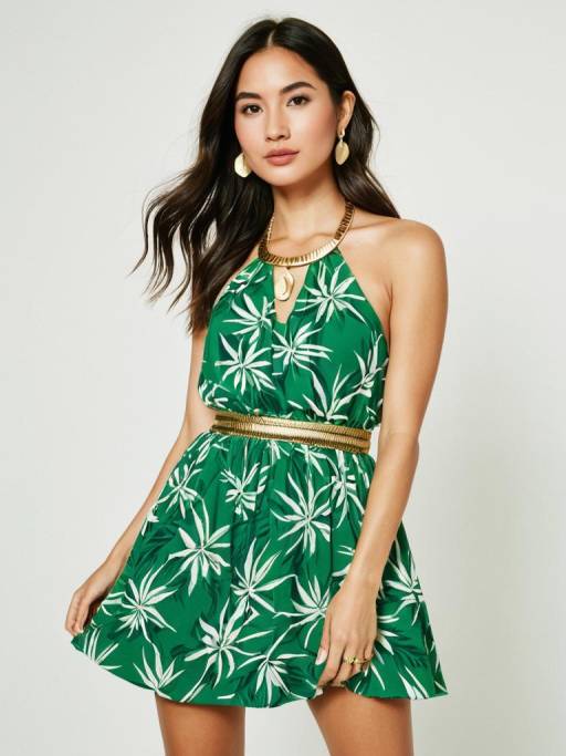 Woman in Green Tropical Leaf Dress