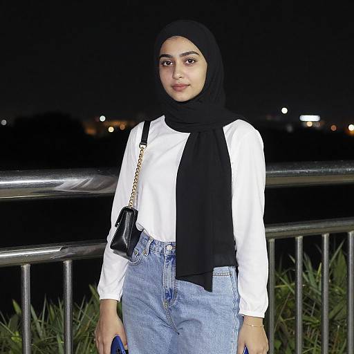 Young Woman in Black Hijab at Night