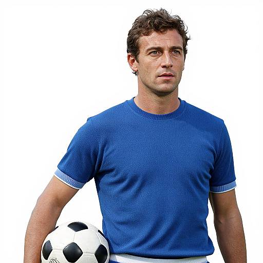 Photograph of a young man with short, curly brown hair, wearing a blue, textured, short-sleeved shirt, holding a soccer ball.