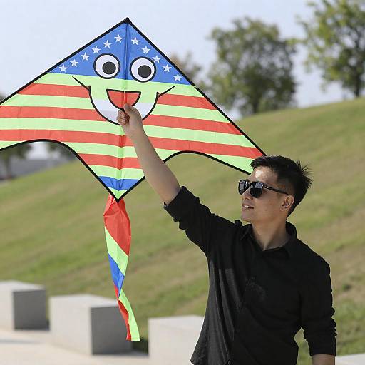 Joyful Man Flying Colorful Kite Outdoors