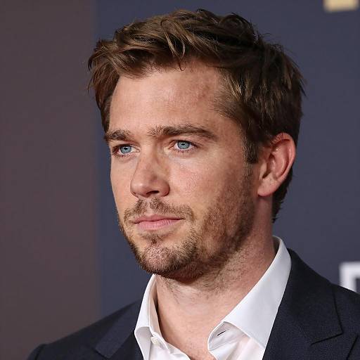 Portrait of Man with Blue Eyes and Light Stubble