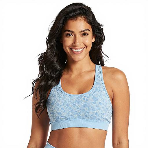 Smiling woman in blue floral sports bra