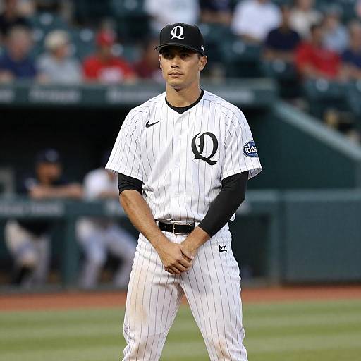 Baseball Player in White Pinstriped Uniform