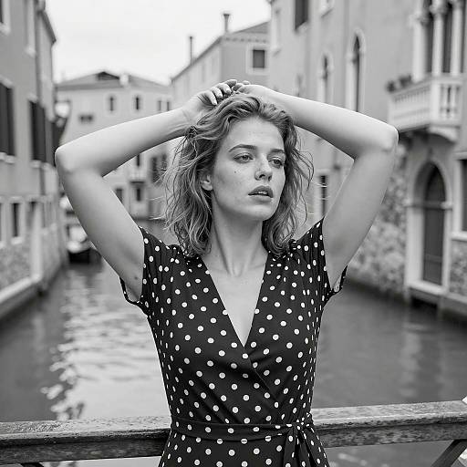 Contemplative Woman in Polka Dot Dress Near Canal