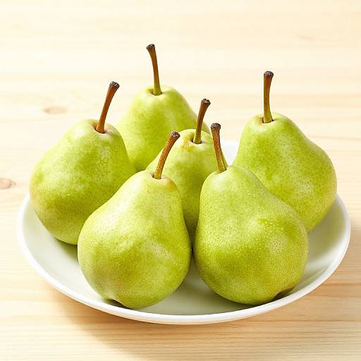 Vibrant Green Pears on White Plate