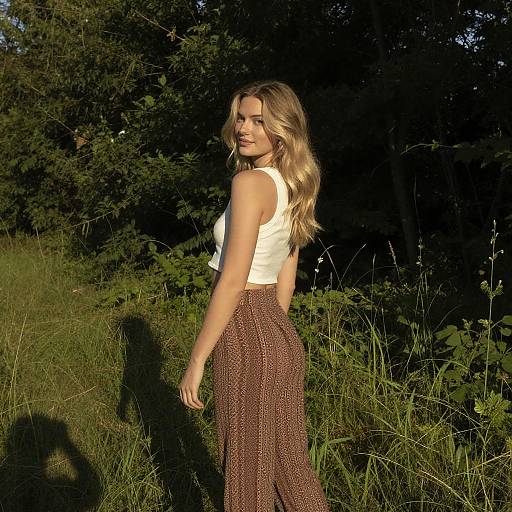 Blonde Woman in Sunny Grassy Field