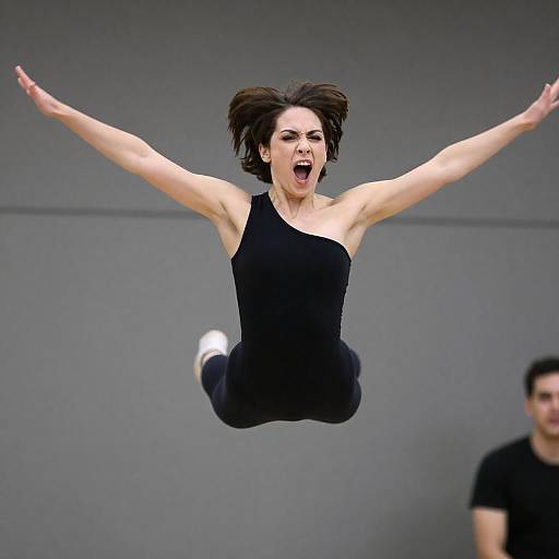 Woman Mid-Air Jump with Intense Expression