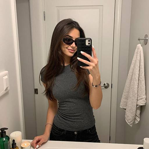 Young Woman Taking Mirror Selfie in Bathroom