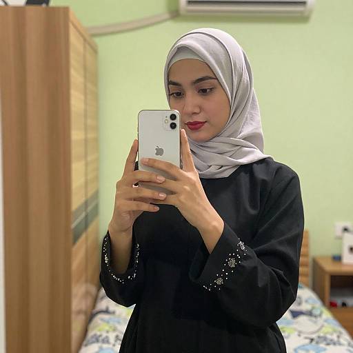 Young Woman in Hijab Taking Selfie