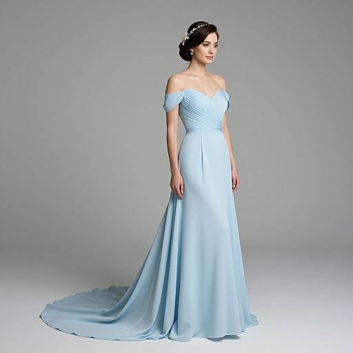 Photograph of a fair-skinned woman with dark hair in an updo, wearing an off-shoulder, light blue, mermaid-style wedding
