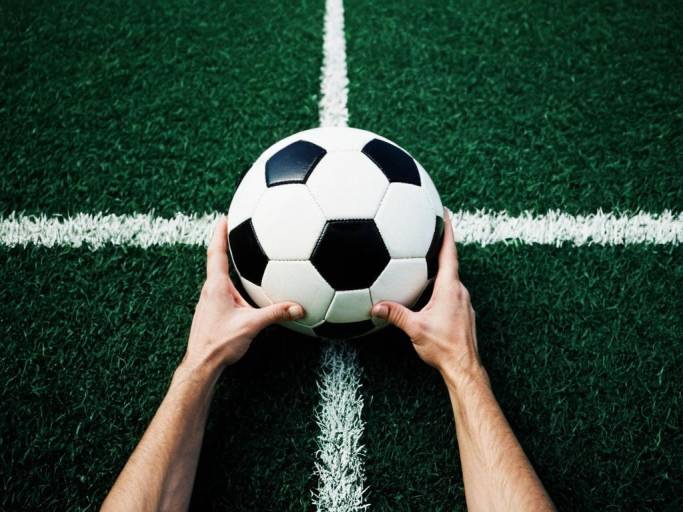 Soccer Ball Wallpaper with Hands Design