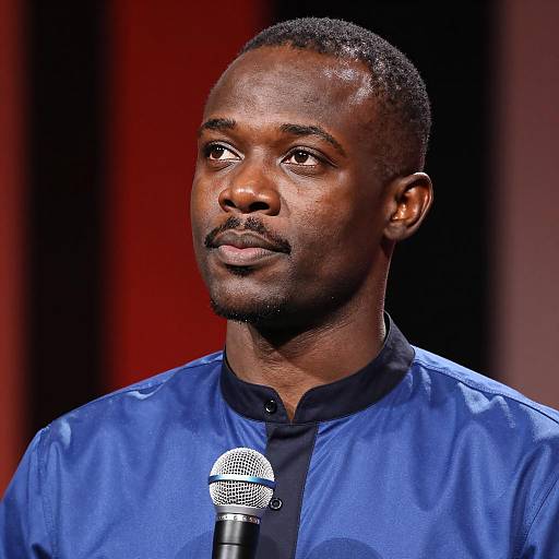Man with Microphone and Striped Background