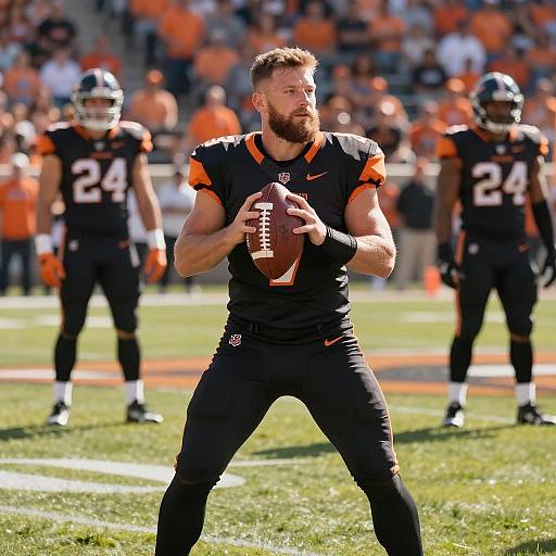 Football Quarterback Holding Ball on Field