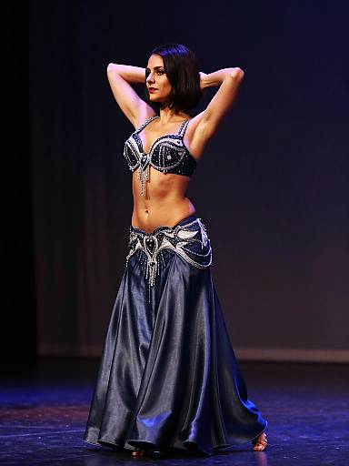 Belly dancer in ornate midnight blue costume