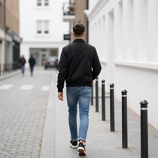 Young Man Walking Narrow Urban Alley