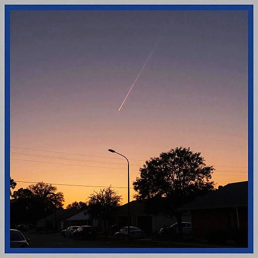 Sunset Meteor Over Silhouetted Landscape