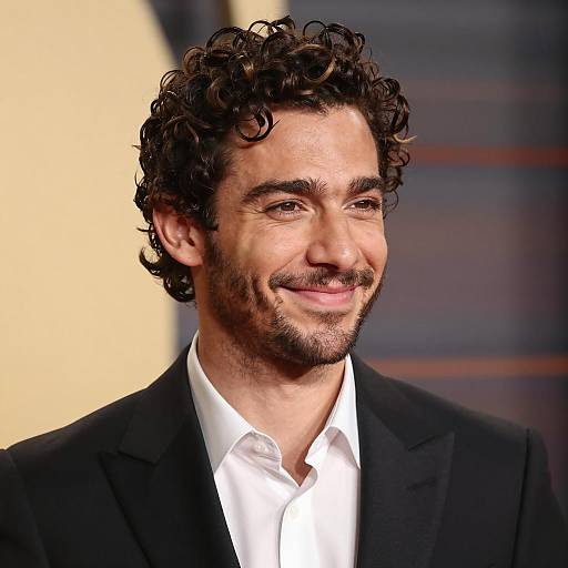 Smiling man in black suit