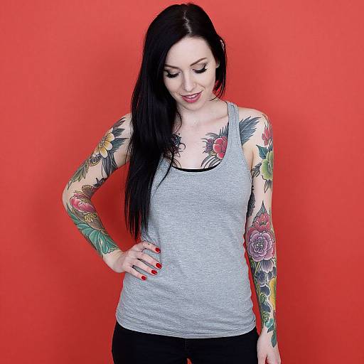 Smiling Tattooed Woman in Red