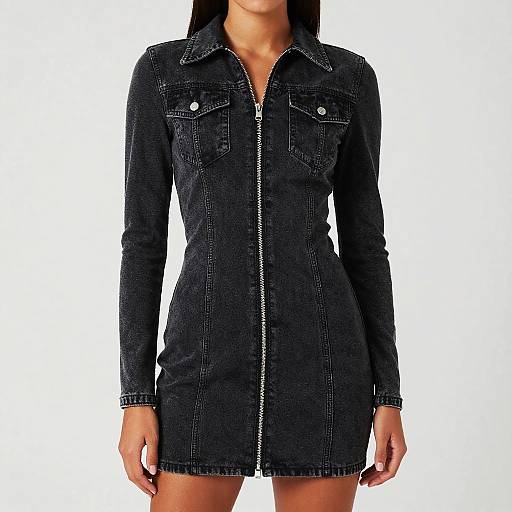 Photograph of a woman wearing a black, long-sleeved, denim dress with a front zipper, buttoned chest pockets, and white buttons.