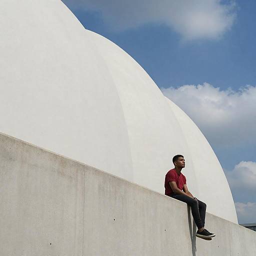 Young Man by Curved White Walls