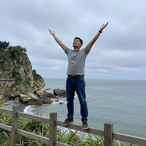 Man Embracing Nature on Cliffside