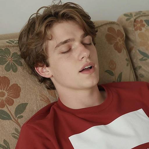Relaxed Young Man on Floral Couch