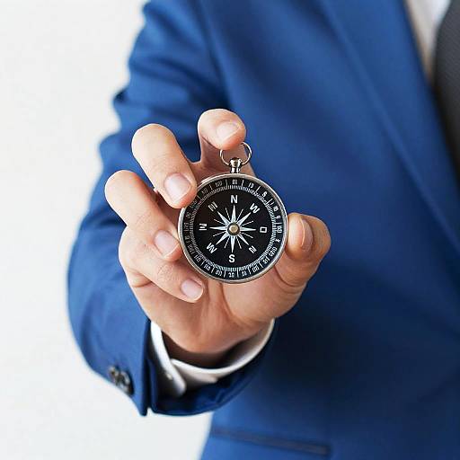 Close-Up of Hand Holding Silver Compass