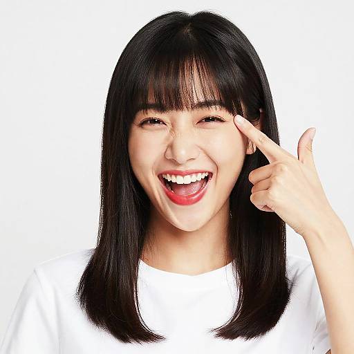 Joyful Asian Woman with Bangs and Red Lipstick