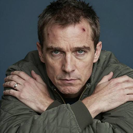 Serious Man in Green Jacket Portrait