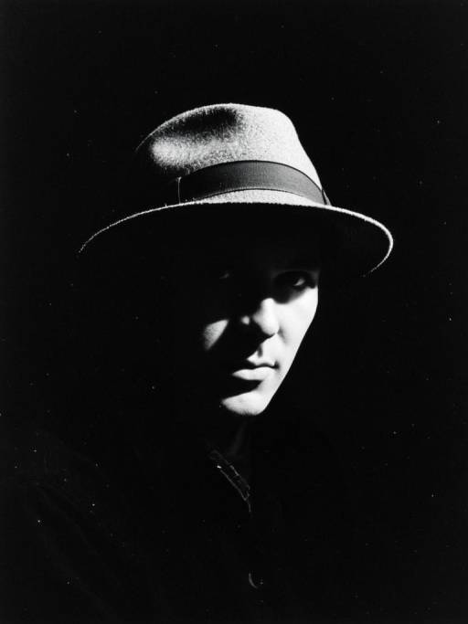 Dramatic Waist-Up Portrait with Hat